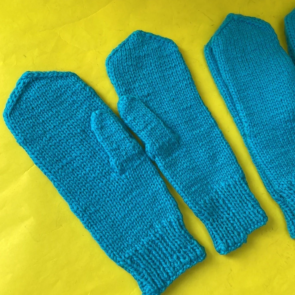 New turquoise hand knitted wool mittens